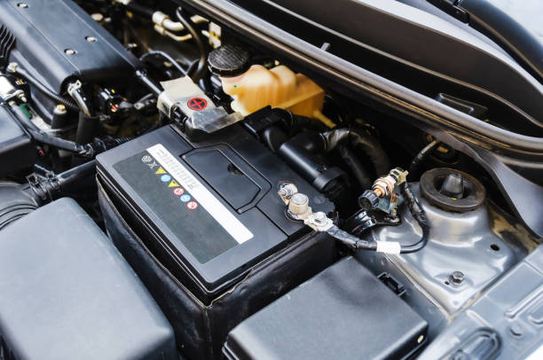 istockphoto-2158421914-612x612 battery is under the open hood of the car. Terminal for disconnecting the battery in the car before parking for a long time